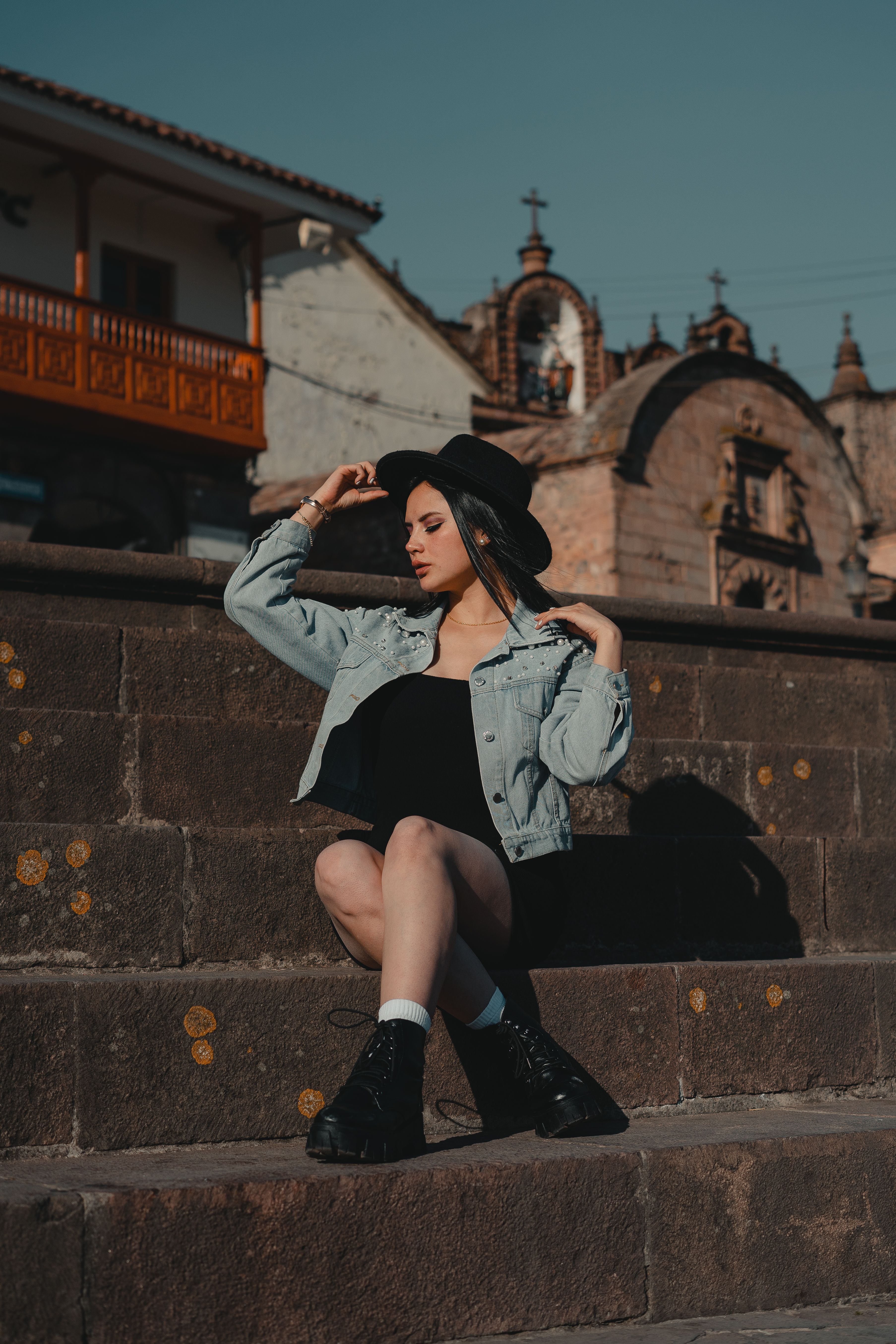 Woman in a Denim Jacket Sitting on the Steps · Free Stock Photo