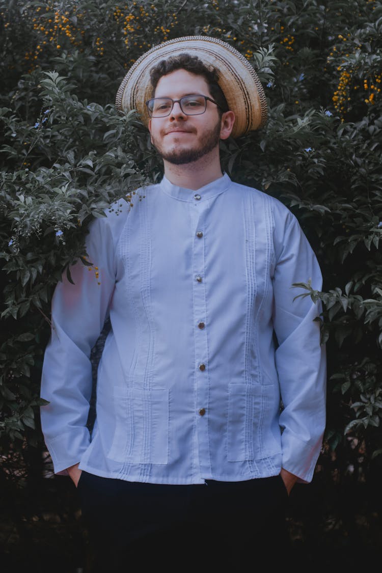 Smiling Man In A Shirt, Hat And Eyeglasses