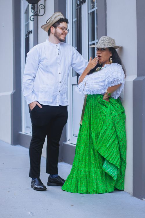 Free A fashionable couple wearing traditional clothing, posing stylishly outdoors. Stock Photo