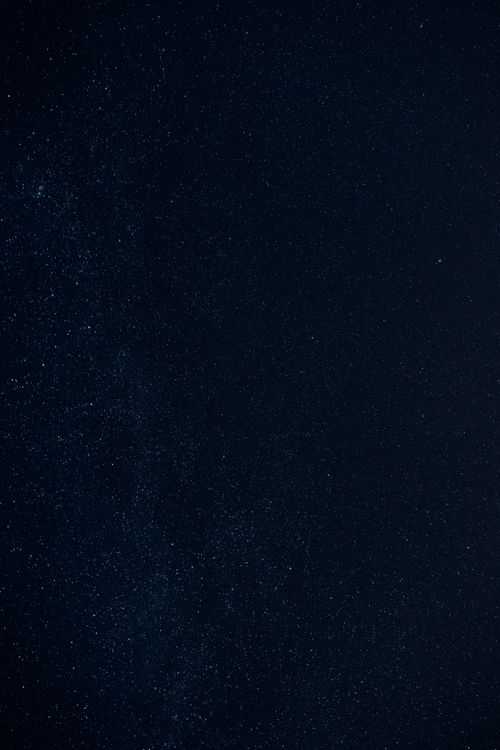 Free A captivating view of a dense star field against a clear night sky, showcasing the vastness of space. Stock Photo