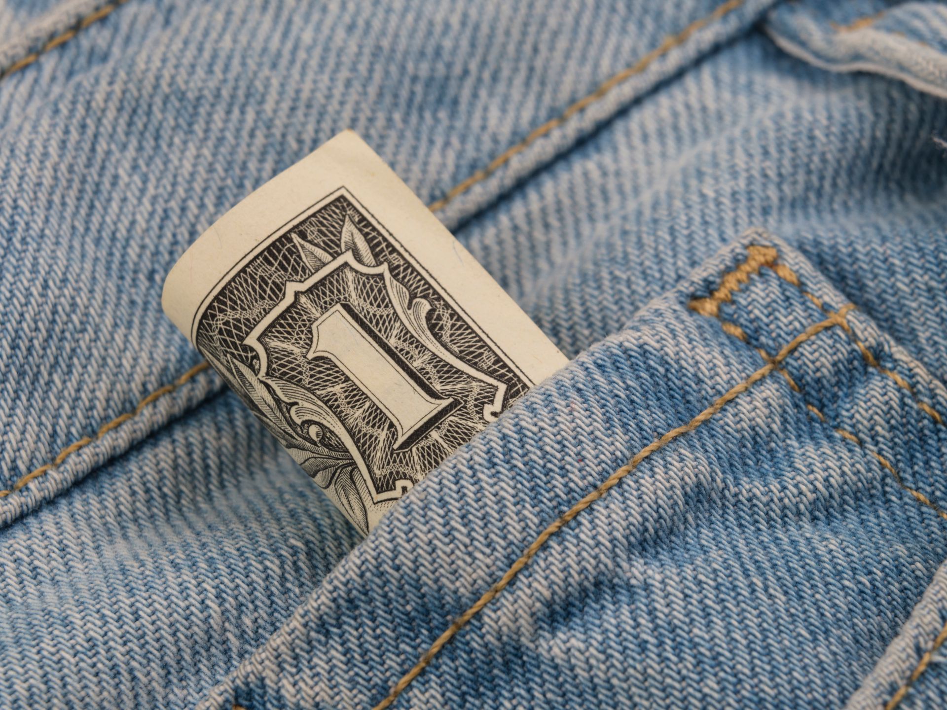 1 US dollar in jeans pocket