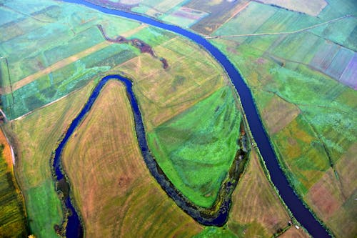 River among Rural Fields