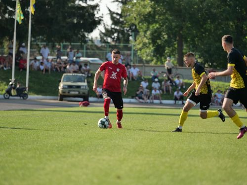 Free A competitive outdoor soccer match featuring players in dynamic action on a sunny day. Stock Photo