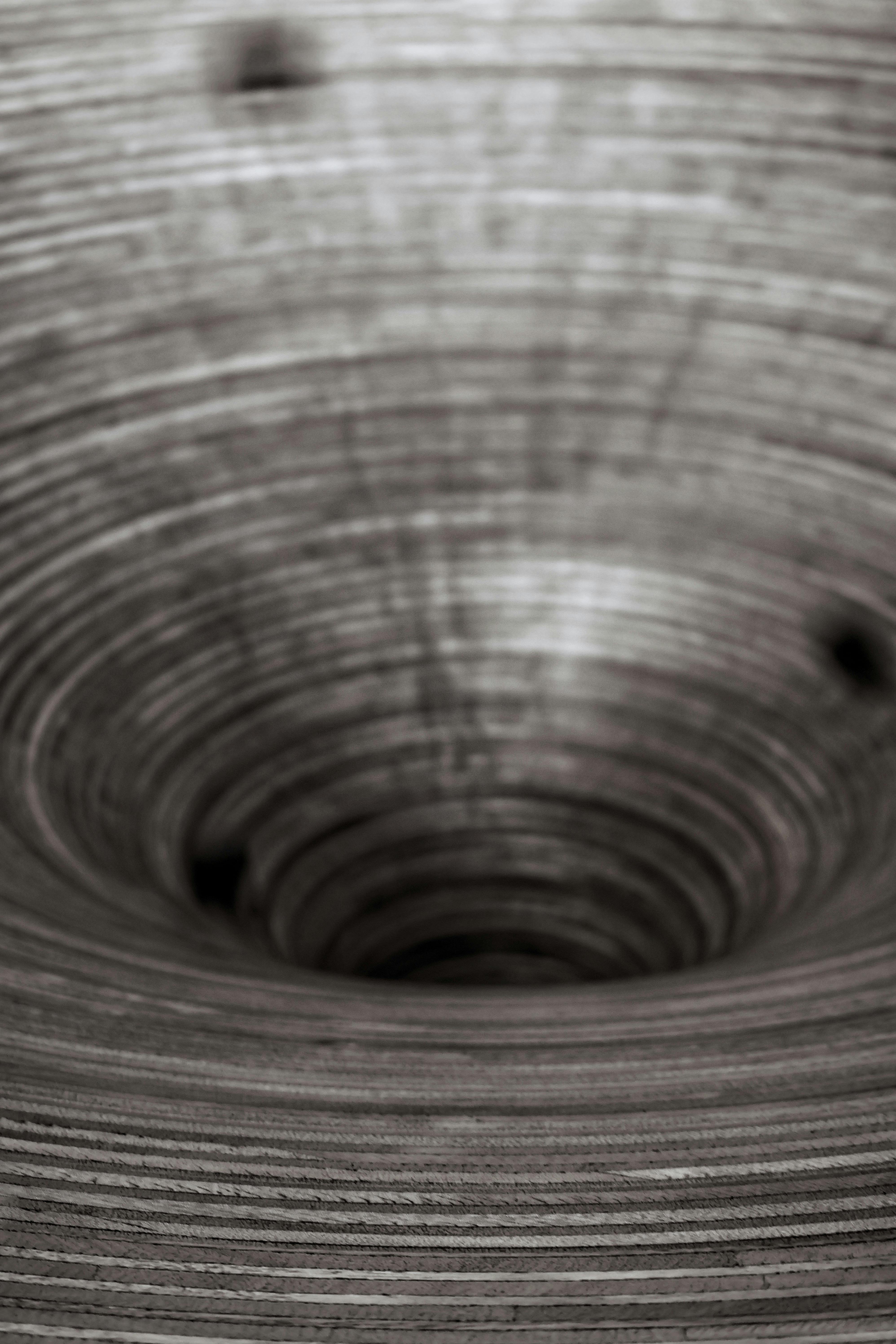 A captivating black and white spiral pattern with selective focus, evoking a sense of depth.