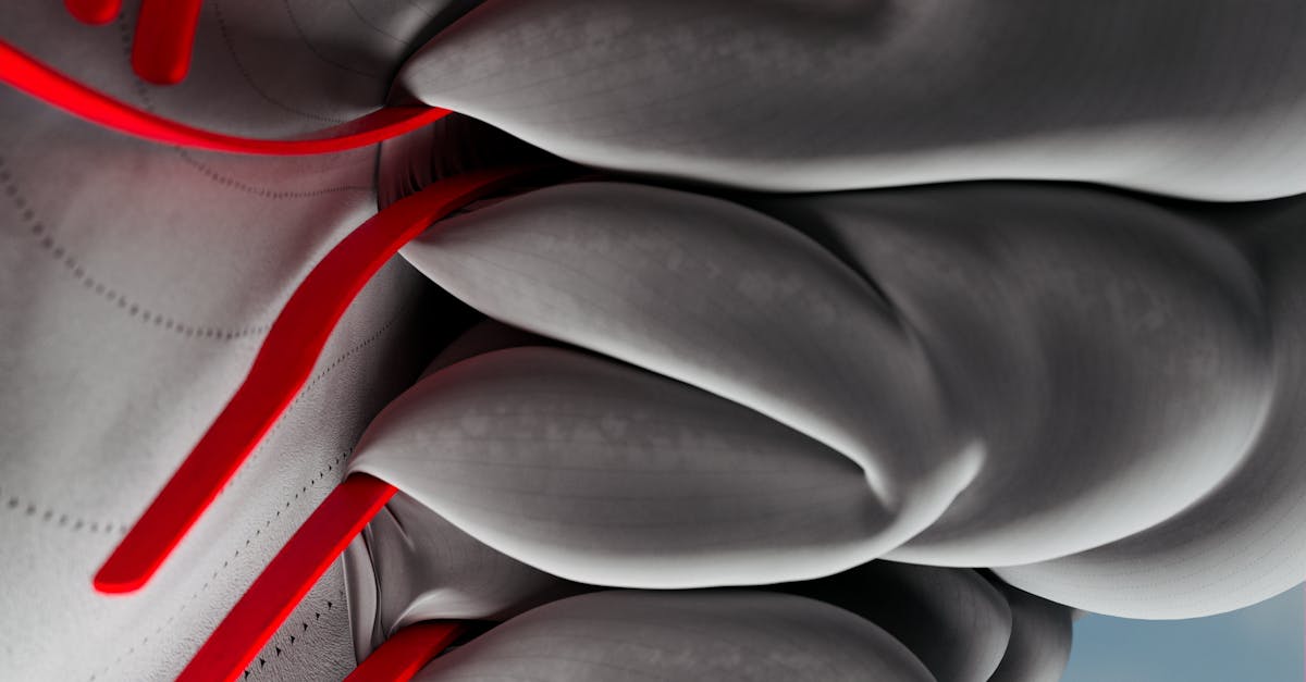 Photo by Google DeepMind A striking abstract image depicting AI neural network concepts with bold red lines and soft gray forms.