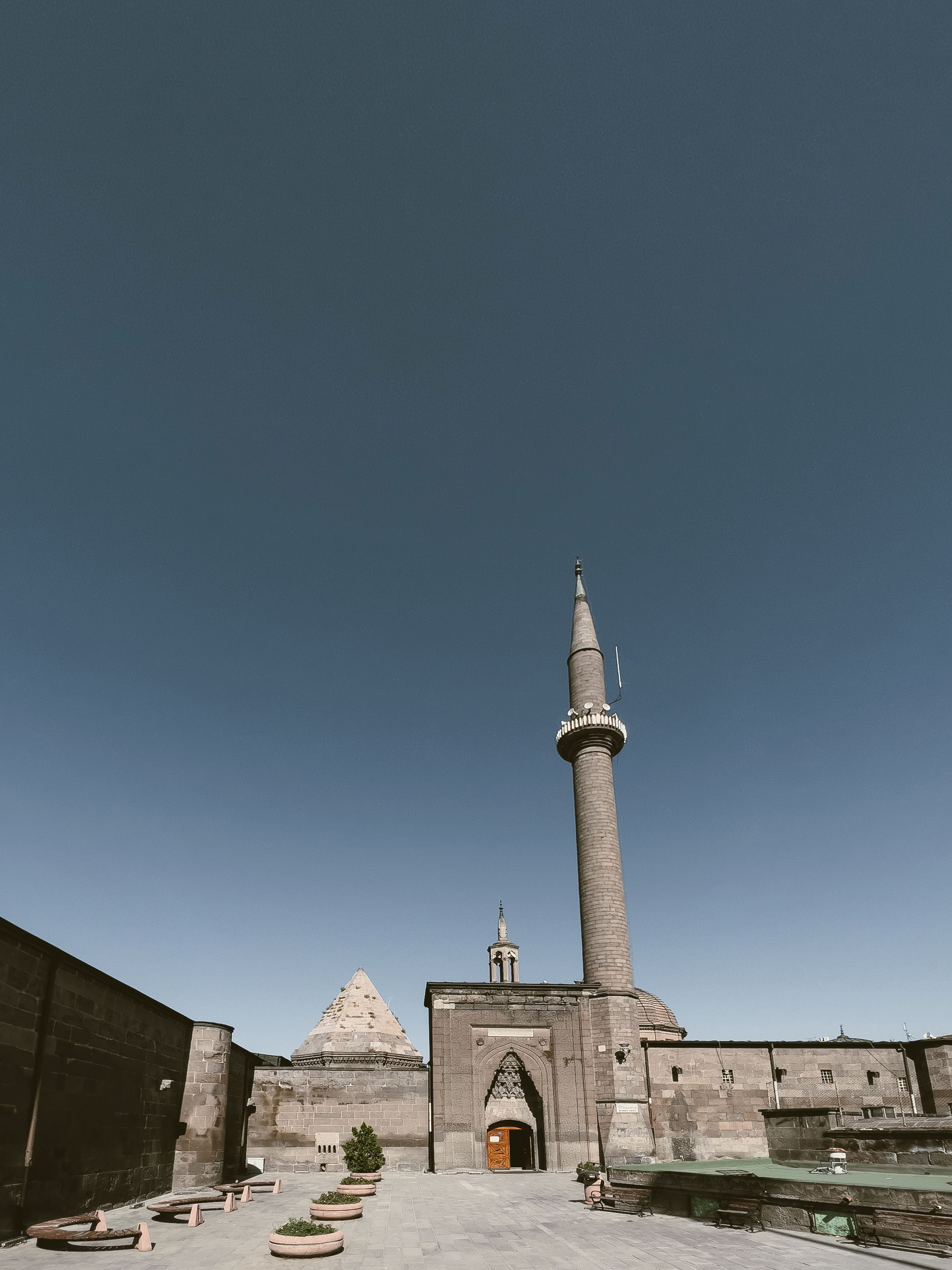 Old Stone Mosque and Minaret on City Square · Free Stock Photo
