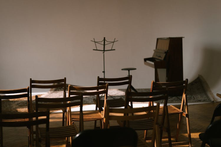 Sheet Music Stand And Piano In Front Of Empty Seats