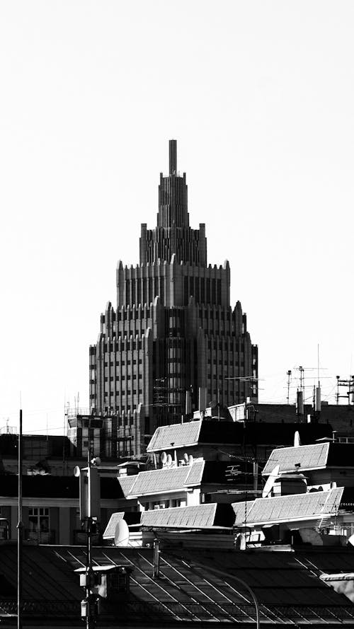Black and White Photo of a Tower-like Modern Building