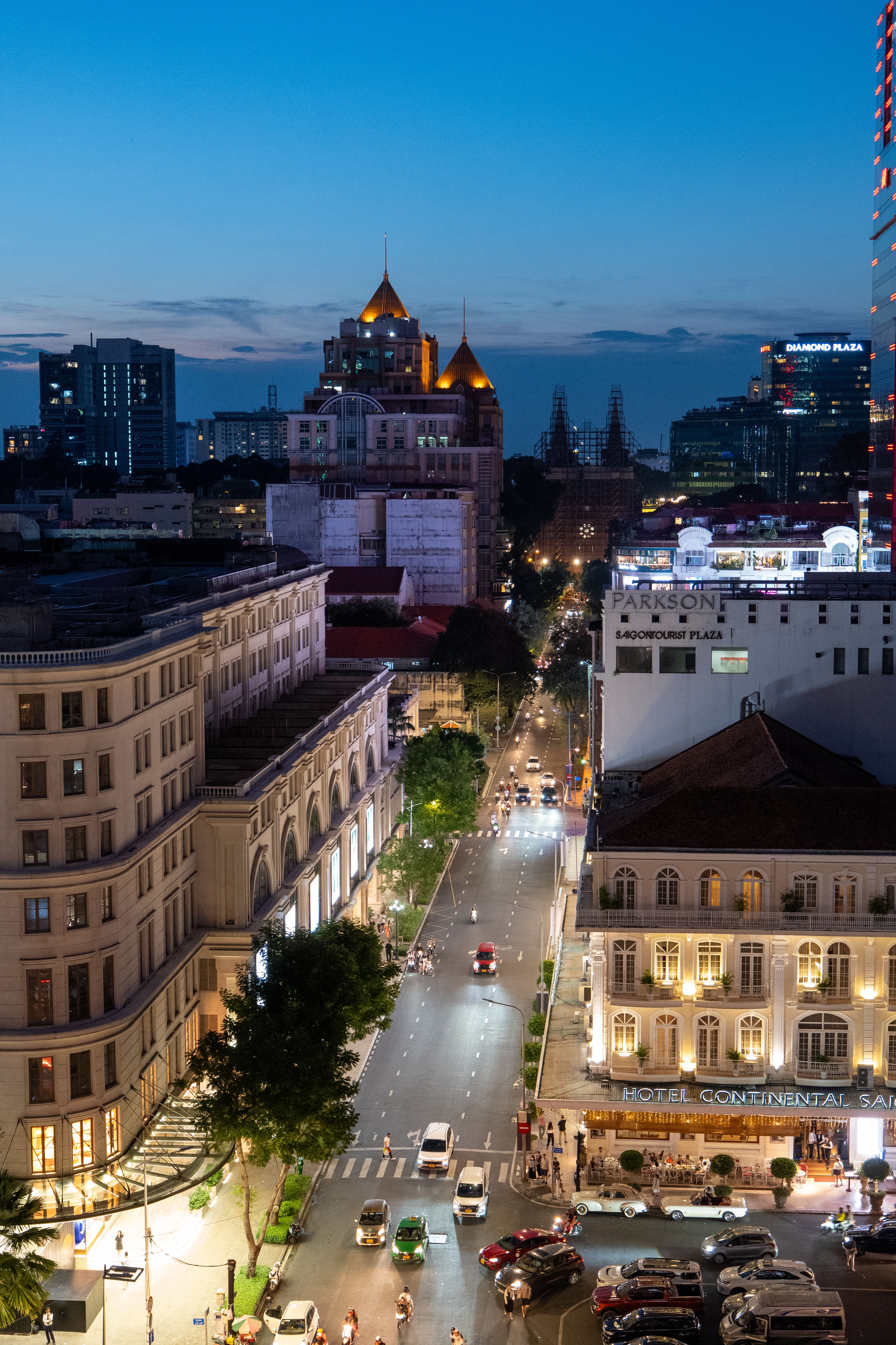 A vibrant view of Ho Chi Minh City's skyline at twilight, showcasing the bustling streets.
