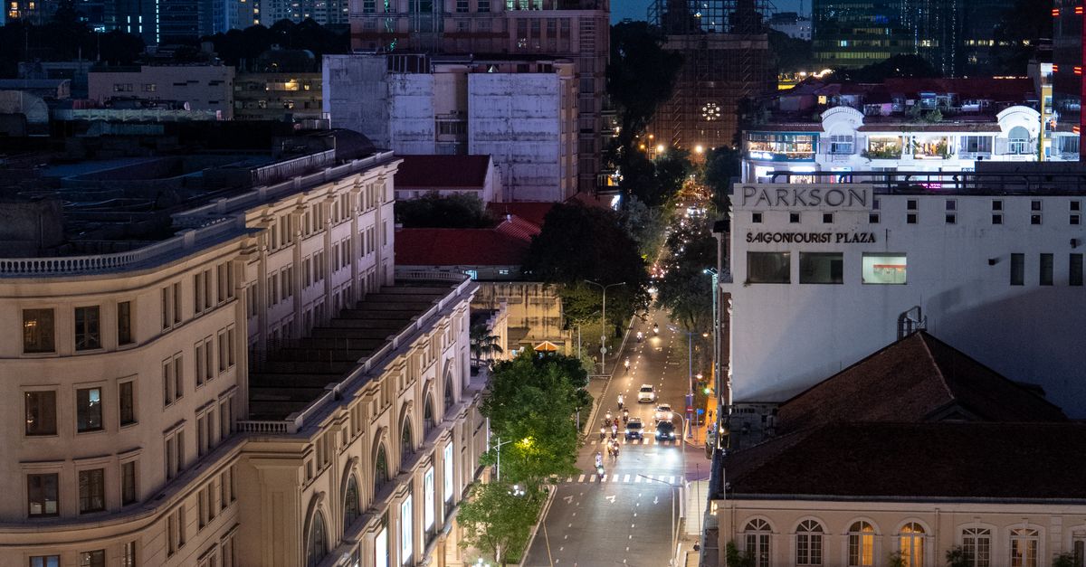 A vibrant view of Ho Chi Minh City's skyline at twilight, showcasing the bustling streets.