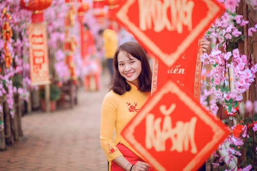 Selective Focus Photo of Woman Wearing Yellow Top