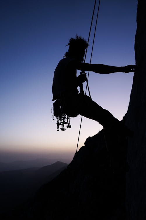 Free Silhouette of Climber on Mountain Stock Photo