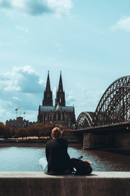 Tourist Looking at Gothic Cathedral in Cologne