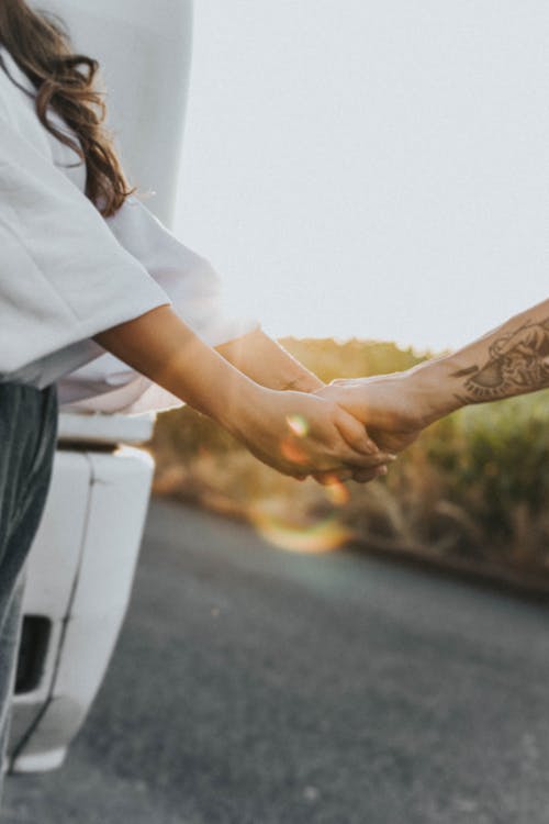 Two People Holding Hands