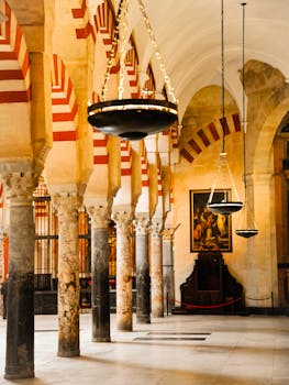 Beautiful arches and columns inside the Mezquita-Catedral de Córdoba, showcasing Moorish architecture.