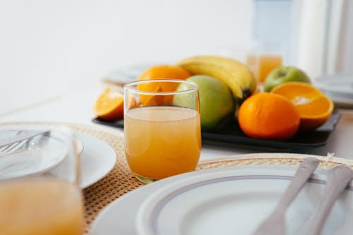 Fruit, Glass of Juice, and a Plate
