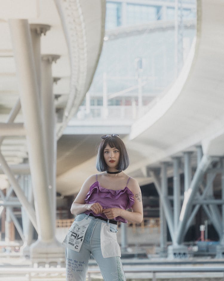 Young Woman In Purple Top And Jeans