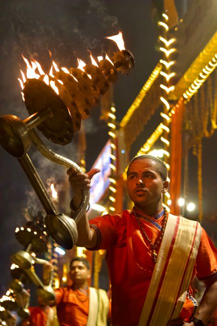 Captivating night view of Ganga Aarti ceremony in Varanasi with traditional rituals.