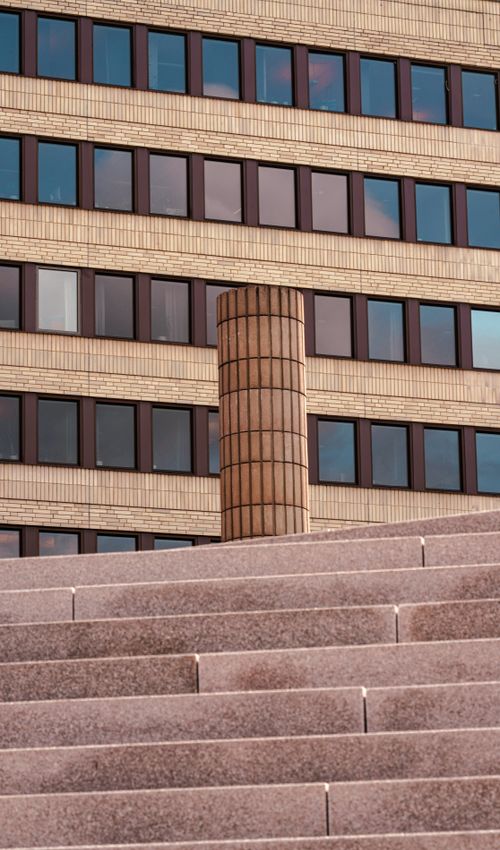 Free Modern building facade and concrete steps showcasing urban architectural design. Stock Photo