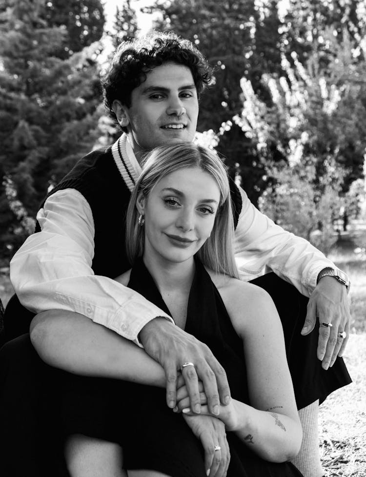 A Young Couple Posing Outside 