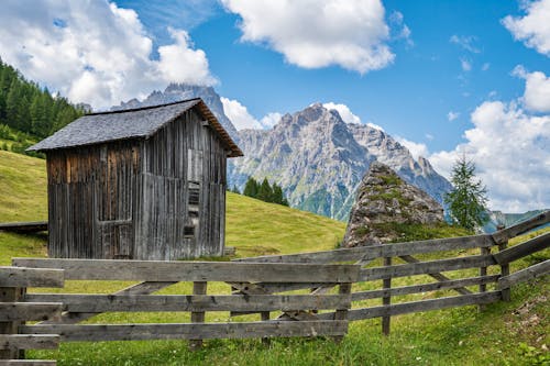 A Wooden Fence and Hut in Mountains 