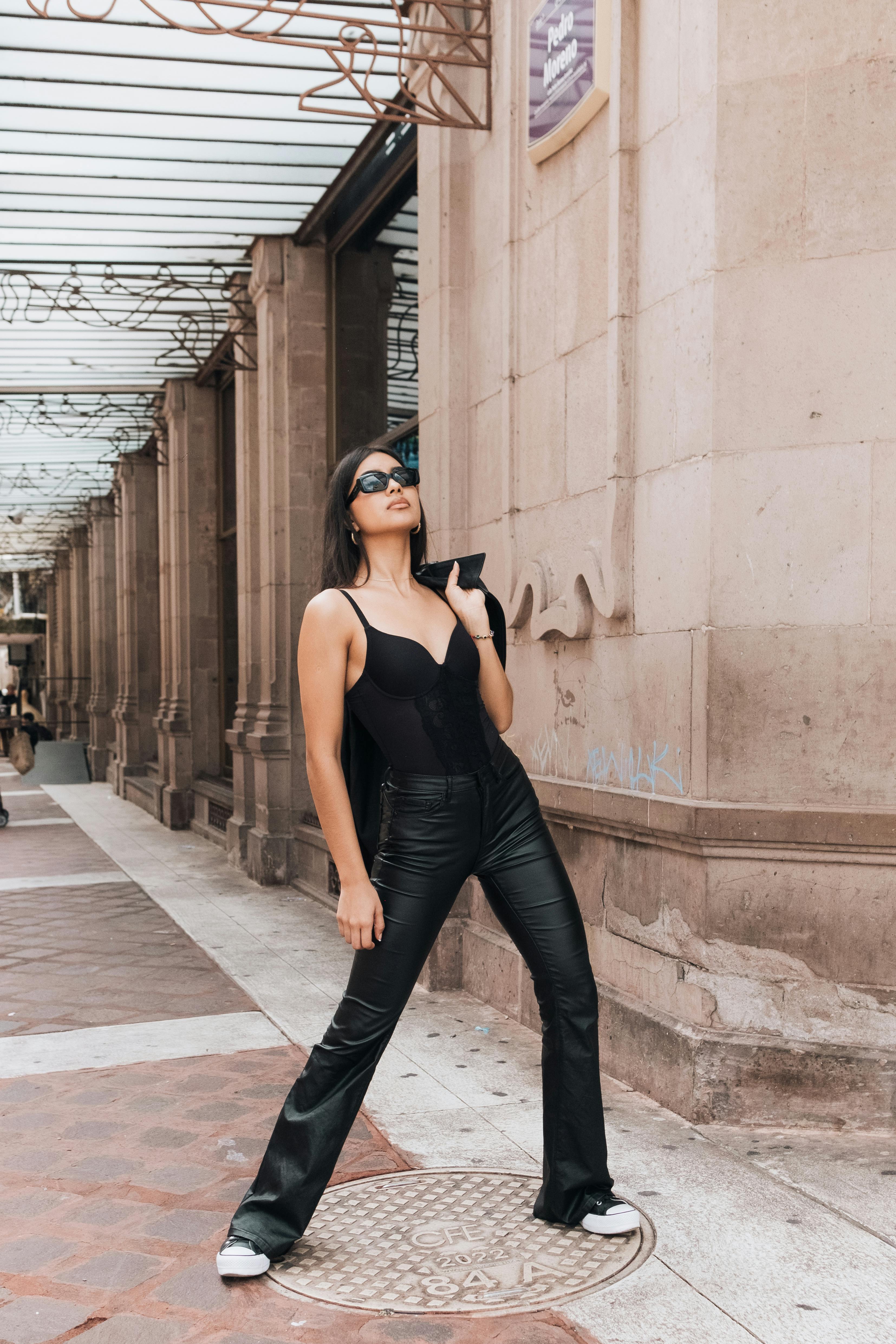 Hipster Outfit. Model Posing in Street, Wearingwearing White Pants,t-shirt,  Black Leather Jacket and Dark Boots . Female Fashion Stock Photo - Image of  lady, freedom: 170868756
