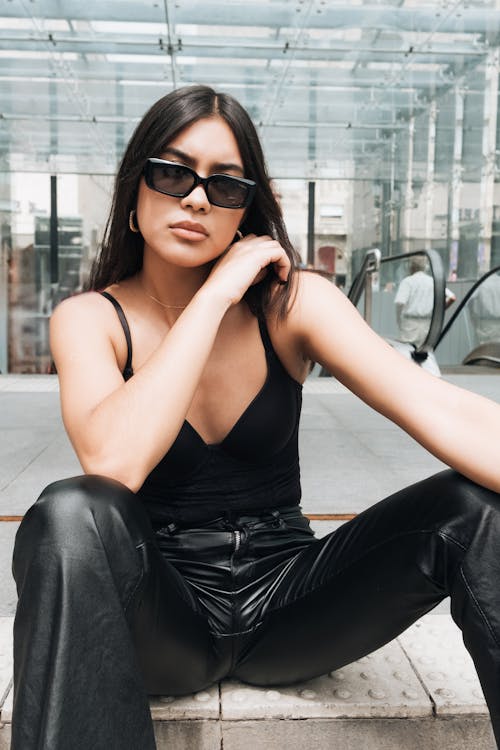 Young Woman in an All Black Outfit and Sunglasses