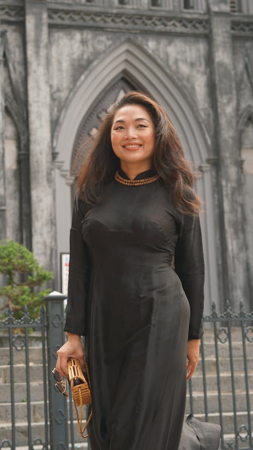 Portrait of Smiling Woman in Black Dress