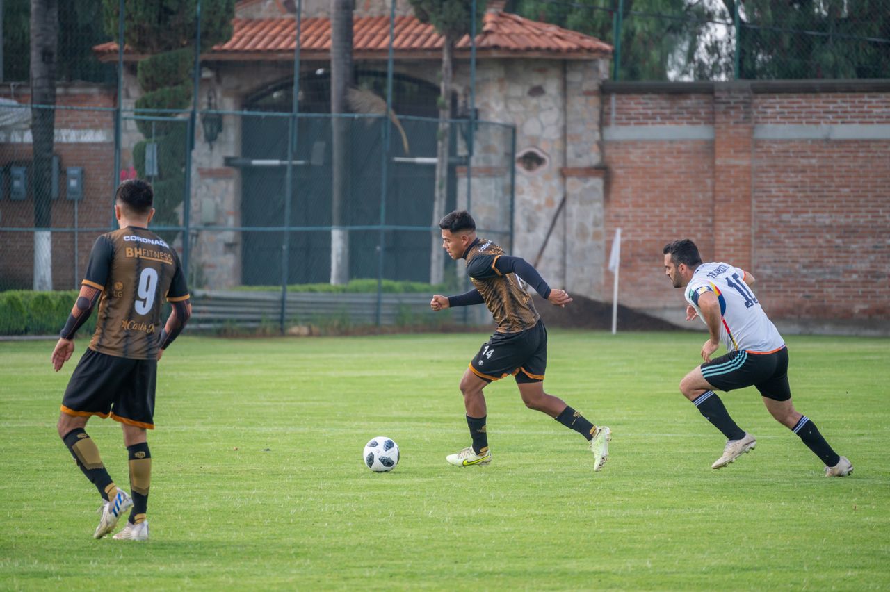 dynamic action shot of soccer players competing on a grassy field in t
