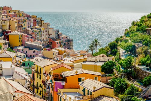 Free Brightly colored hillside houses overlook the sea in scenic Manarola, Liguria. Stock Photo
