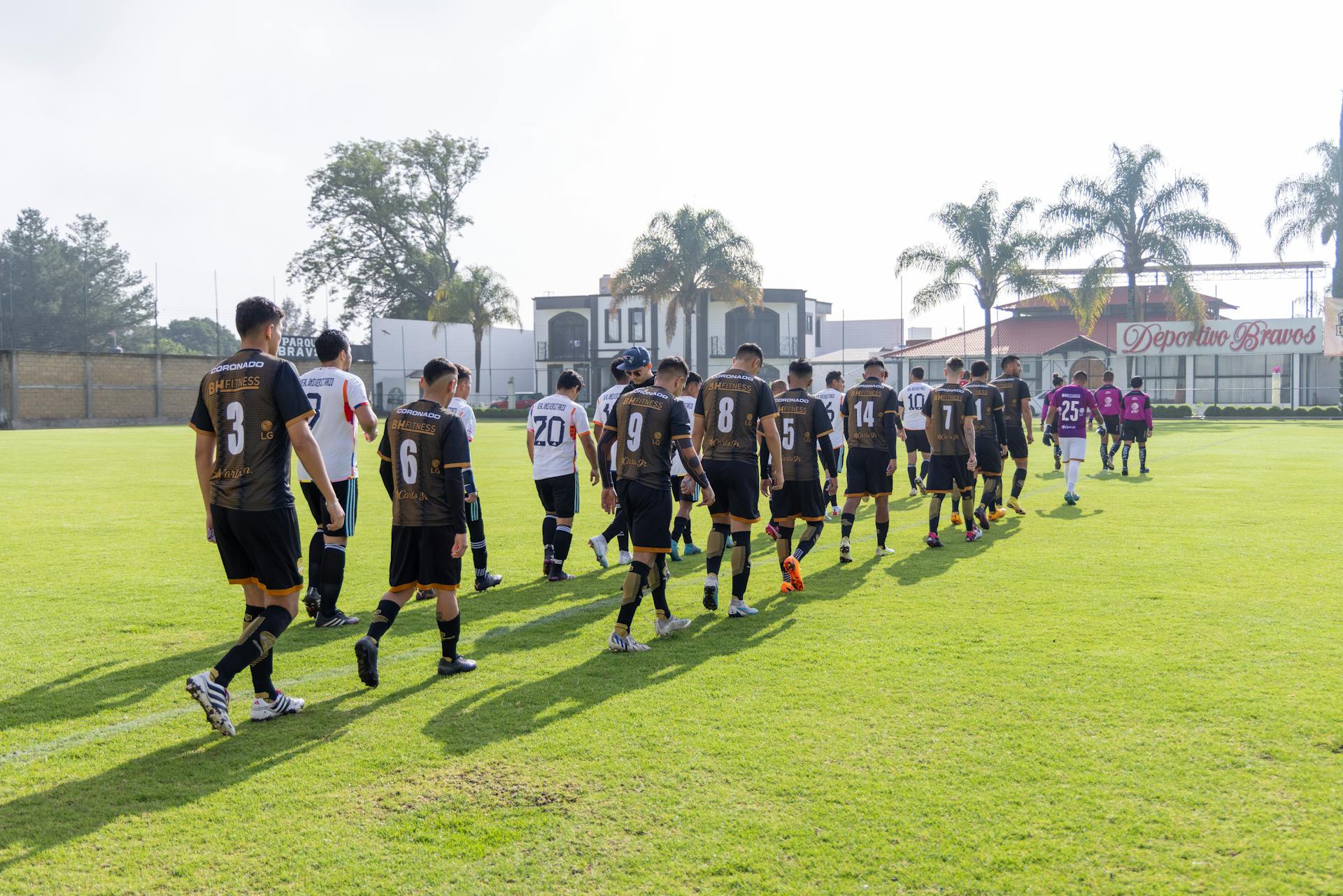 Group of soccer players entering the field at Deportes Bravos stadium, Texcoco, Mexico.