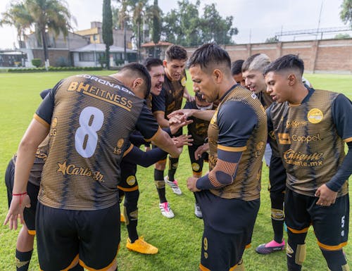 Soccer Players Making Huddle before Match