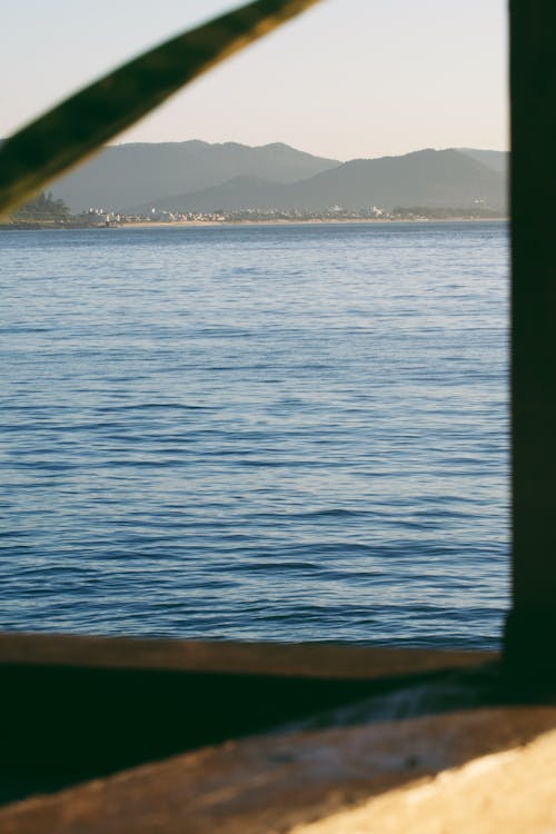 View of a Sea by the Mountains