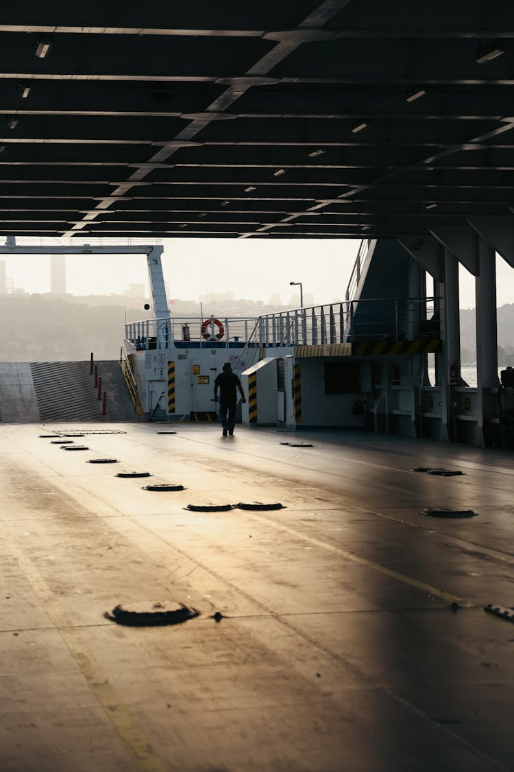 Man Walking On Ferry Car Deck