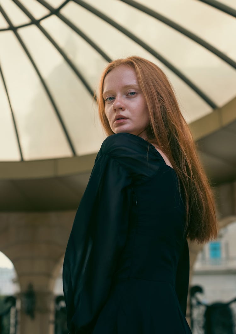 Young Woman Looking Over The Shoulder 