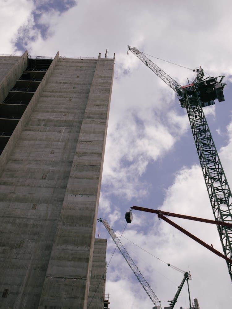 Crane Working Near Modern Building 