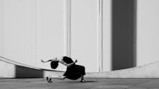 Woman Dancing near Wall on City Street