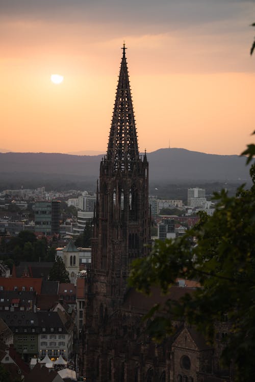 A view of a church tower at sunset