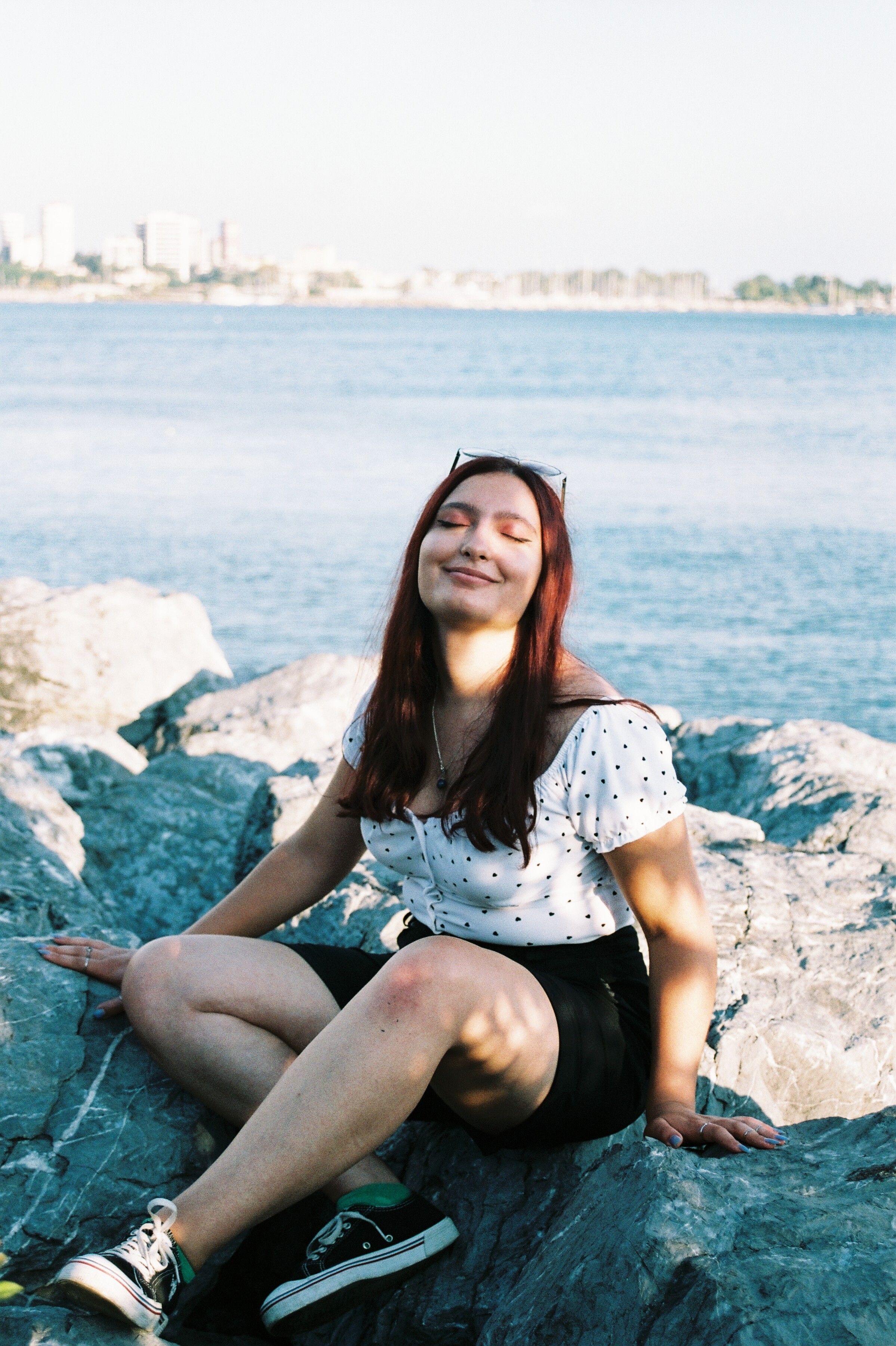 A Woman Sitting with her Eyes Closed · Free Stock Photo