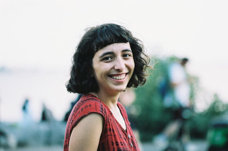 Portrait Of A Young Happy Woman Outside 