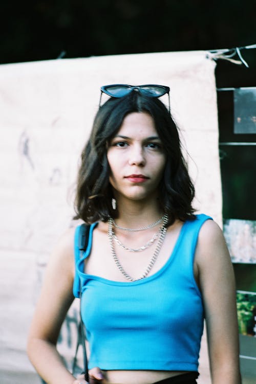 Portrait of Young Woman with Sunglasses on Head