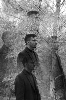A creative black and white portrait using double exposure in a park setting, capturing multiple angles.
