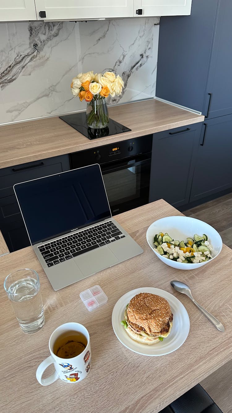 A Breakfast And Laptop On The Table 