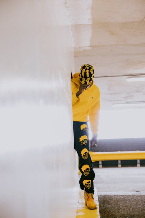 Man in a Black and Yellow Outfit