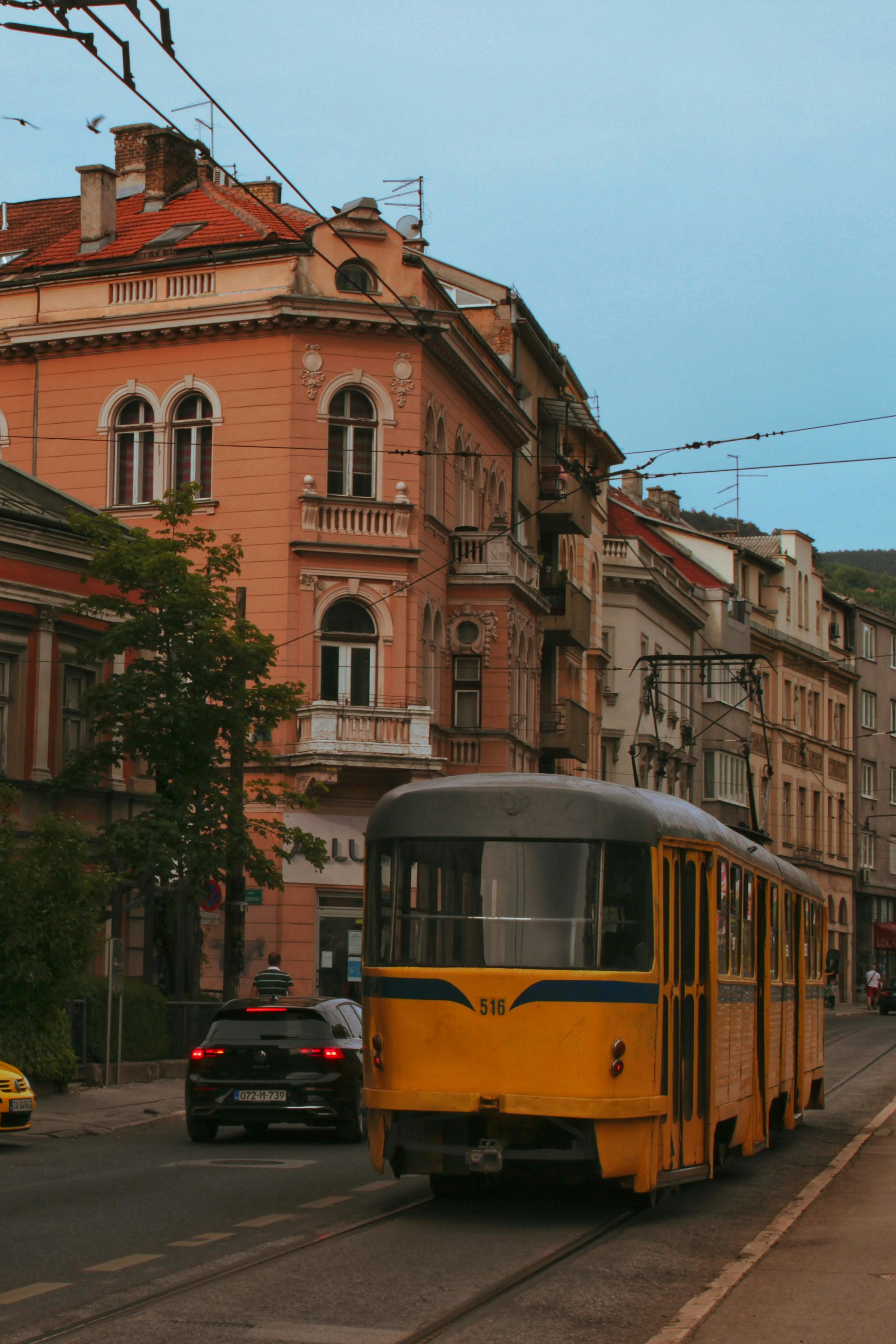 Orange Trams on Tracks · Free Stock Photo