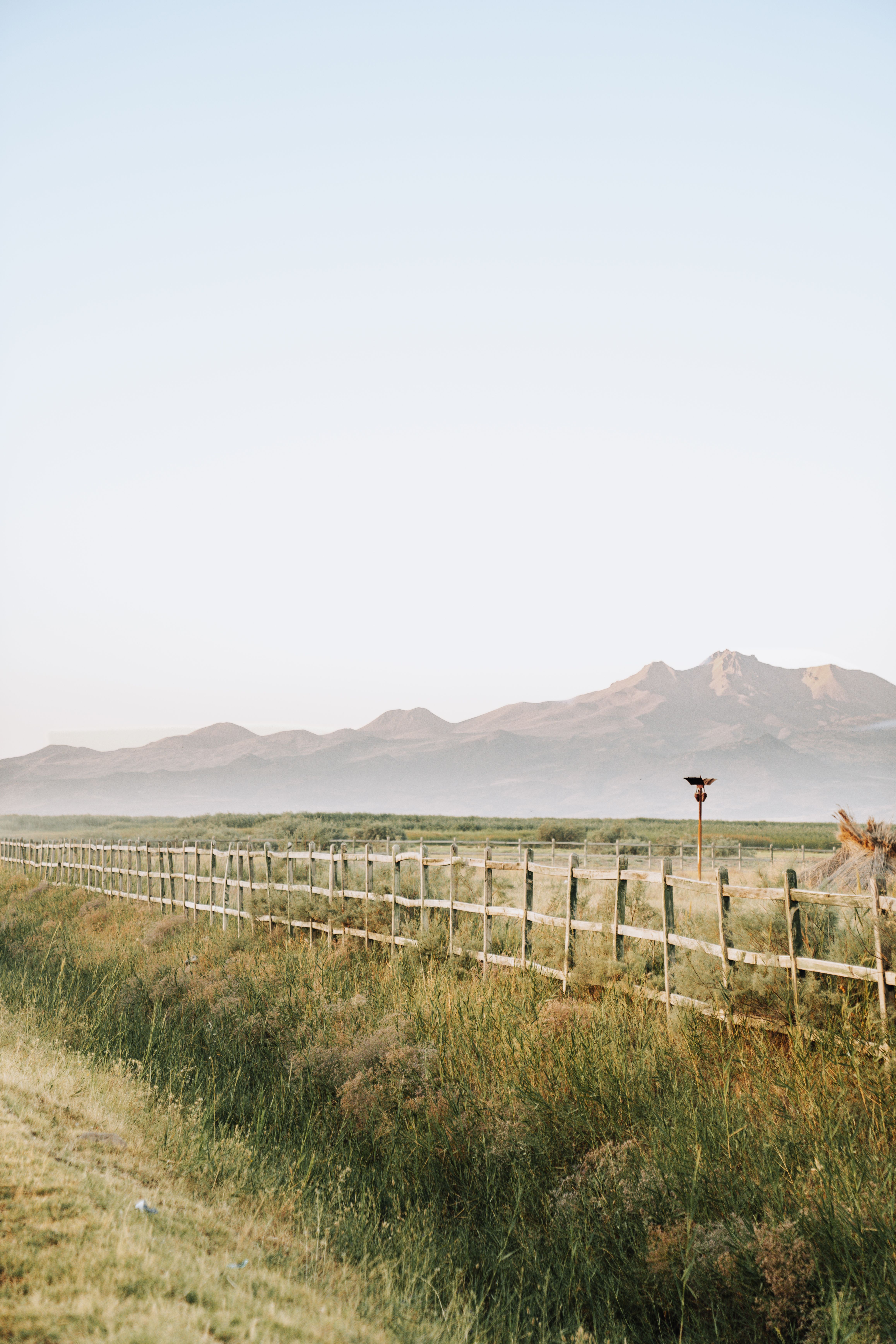 Wooden Fence in Grassland on Sunset · Free Stock Photo