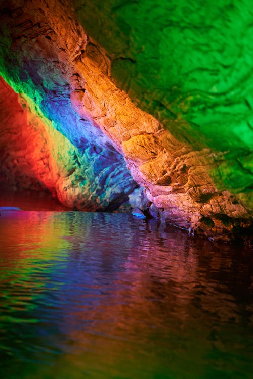 Colorful Lights on a Stone Wall in a Cave 