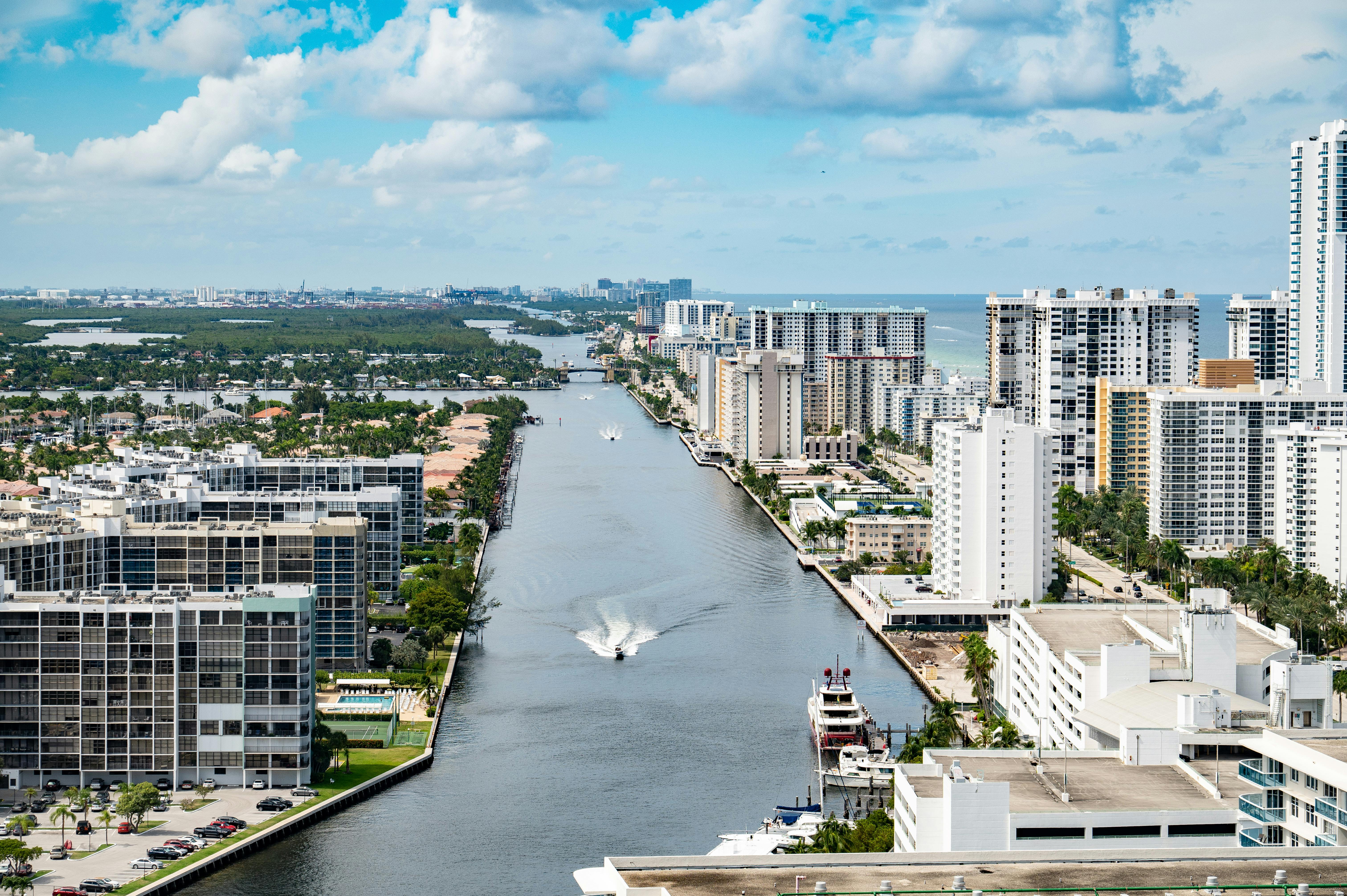 Stunning aerial view of Hollywood, Florida's coastal cityscape with high-rise buildings and a serene waterway.