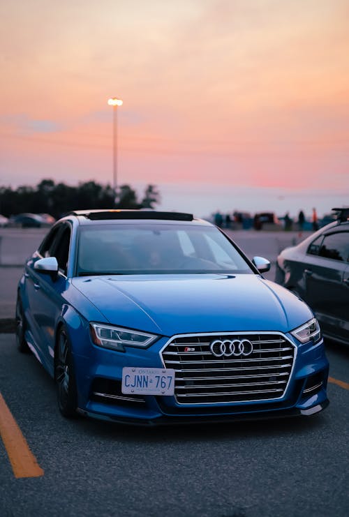 Blue Audi Car at Sunset