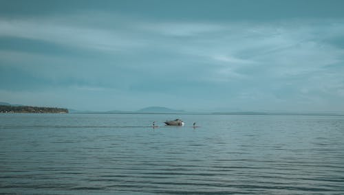 People on Paddle Boards on Sea